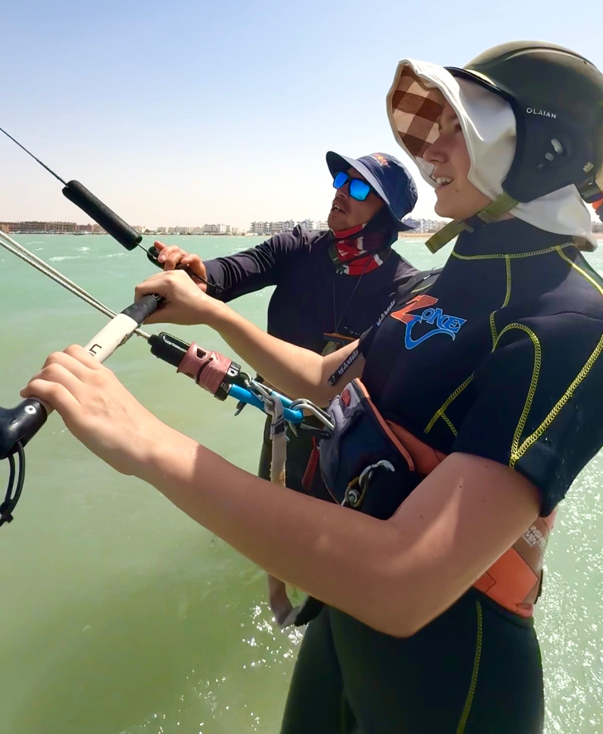 The girl learning how to steer the kite